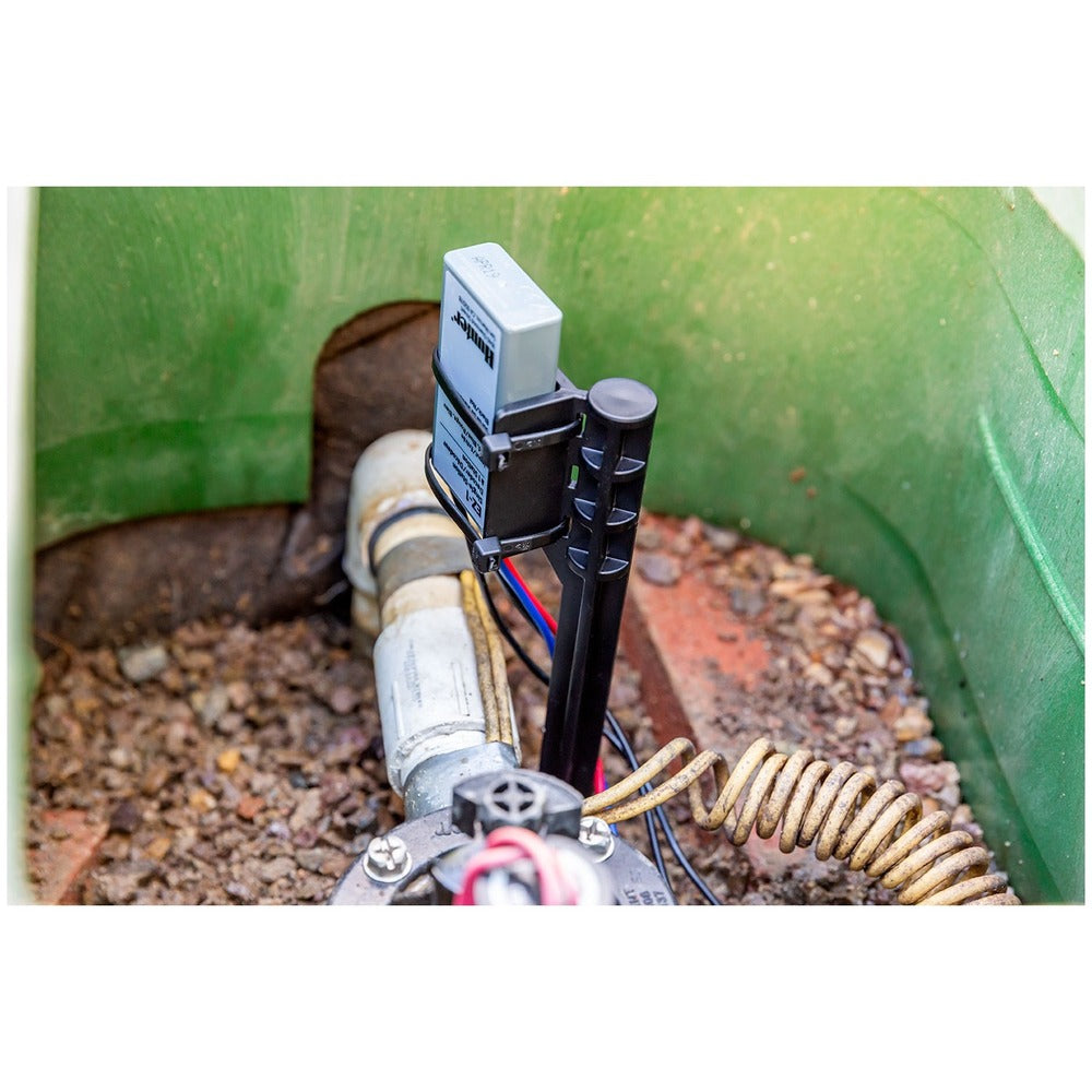 Hunter ICD-400 decoder installed on a stake in an irrigation valve box. Photo courtesy of Hunter Industries Incorporated.